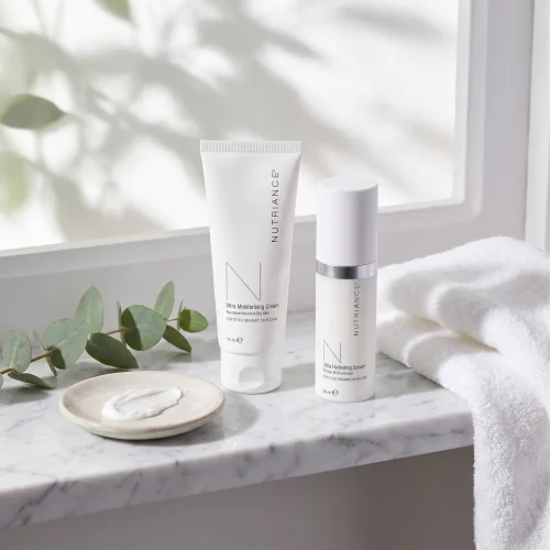 NeoLife Nutriance Ultra Moisturising Cream and Ultra Hydrating Serum on a bathroom shelf